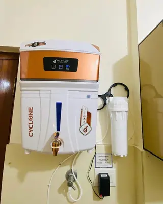 a coffee maker on a wall in a room at Apartment in Guruvayur- Sooryamadhavam-only for families in Guruvāyūr