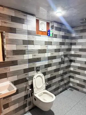 a bathroom with a toilet and a sink at Zerahs Private Pool Villa, Athirappilly - Extra upstair Bed space in Athirappally