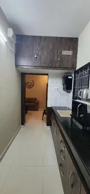 a kitchen with a sink and a counter top at LBS Farms in Coimbatore