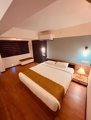 a large bedroom with a large bed in it at Karlad Lake Resort in Wayanad