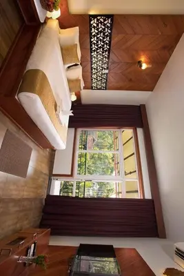 a window in a kitchen with a sink and a window at Karlad Lake Resort in Wayanad