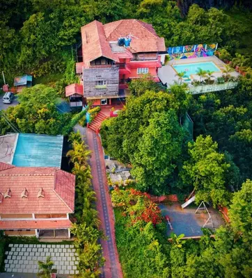 an overhead view of a house with a pool at Girassol Serviced Villa in Vythiri