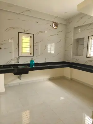 a room with a sink and a mirror in it at Nexus Living in Coimbatore