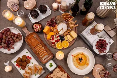 a table topped with plates of food and drinks at StayVista at The Sattva Grove with Pool, Views in Wayanad