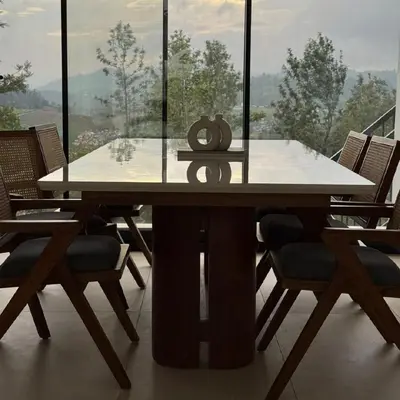a dining room table with chairs and a large window at Ozone The Misty Villa ooty ,Three Bed Room Luxury Private Jacuzzi Villa in Ketti