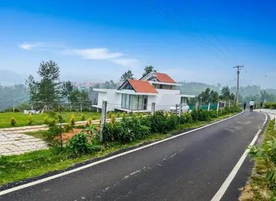 a house on the side of the road at Ozone The Misty Villa ooty ,Three Bed Room Luxury Private Jacuzzi Villa in Ketti