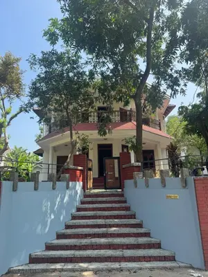 a house with stairs leading up to it at Souparnika Heritage in Tellicherry