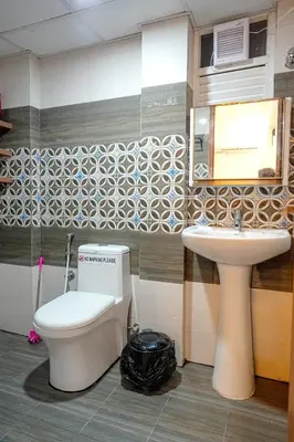 a bathroom with a toilet and a sink at 1 Bhk Luxury Flat in Samudhra Apartments -208 in Guruvāyūr