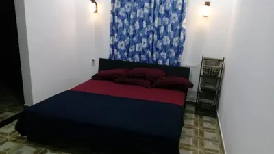 a bedroom with a bed in a room at Skyfall Villa in Chillithodu