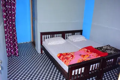 a bedroom with a bed in a room at Brigmonsiya in Vattavada