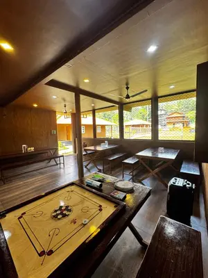 a large room with a ping pong table in it at Marayoor Mud Castle in Marayoor