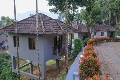 a house in a resort with a porch at Rippon Mount Resorts in Meppādi