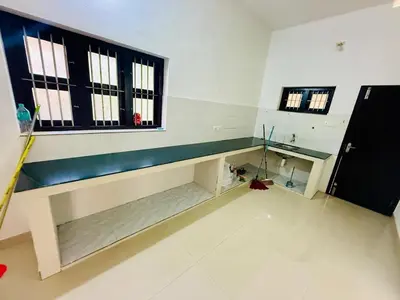 a long bench in a room with a window at Ocean pearl homestay-pariyaapuram