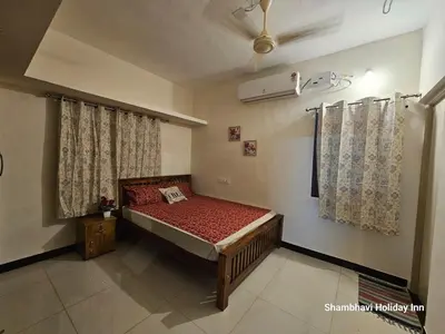 a small bedroom with a bed in a room at SHI's Krishna 2BHK Villa Furnished Cozy Stay in Coimbatore