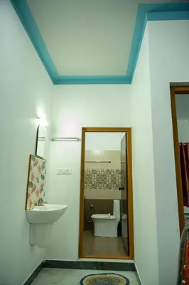 a bathroom with a toilet and a sink and a mirror at The Elephant watch in Viripara