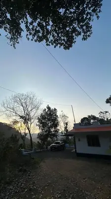 a house with a car parked in front of it at The Elephant watch in Viripara