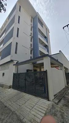 a building with a gate in front of it at Gamani in Mysore