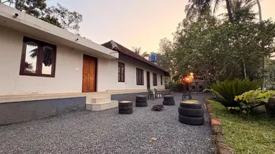 a house with a bunch of tires in front of it at Wildora Junglevilla Wayanad in Chekadi