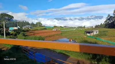 a view of a river from a bridge at Mud bees resort in Kanthalloor