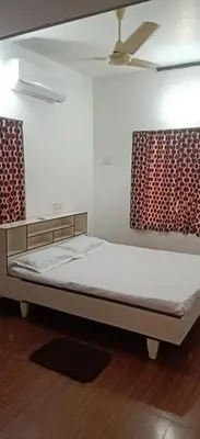 a bed in a room with a ceiling at Garden Beach in Cochin