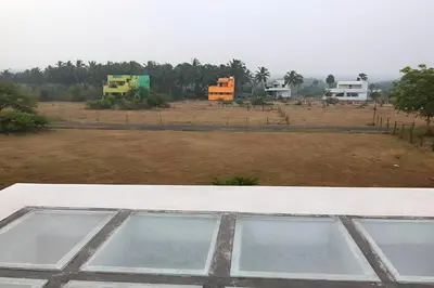 a view of a field from a roof of a house at PK Homestay in Coimbatore