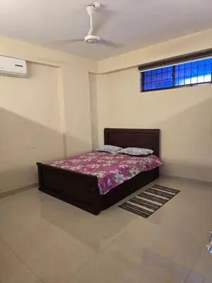 a bedroom with a bed in a room at The Western Castle Apartment - 2BHK Apartment in Kannur