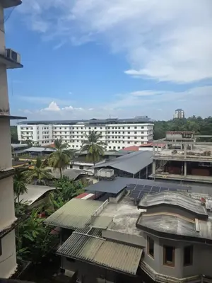 an overhead view of a city with buildings and trees at The Western Castle Apartment - 2BHK Apartment in Kannur
