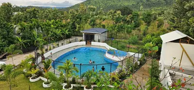 an overhead view of a swimming pool at a resort at Ambience Retreat in Sivasamudram