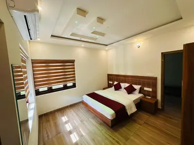 a bedroom with a bed in a room at Honeymoon Holidays in Vythiri