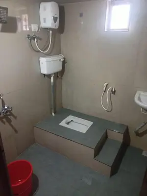 a bathroom with a toilet and a sink at Vattavada Homestay in Vattavada