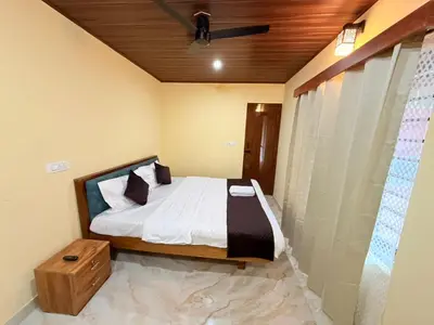 a bedroom with a bed and a wooden ceiling at VIVIPRA Habitat, Coorg in Madikeri