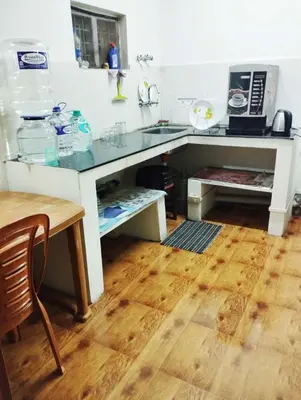 a kitchen with a sink and a counter top at VR Home Stay Ooty in Ooty