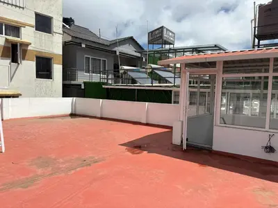a building with a pavilion in front of a building at BBR Residency in Ooty