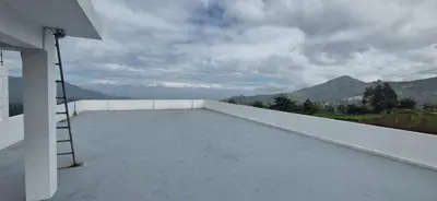a balcony with a ladder on the roof of a house at IndivaStays - Sixface Park in Ooty