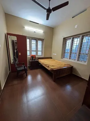 a large room with a large bed in it at Puranattukara- Serene Stay by the Rice Fields in Trichūr