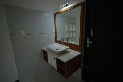 a bathroom with a sink and a mirror at Kadmane Resort in Kākankote