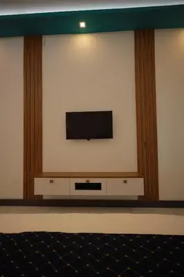 a flat screen tv on a wall at Kadmane Resort in Kākankote