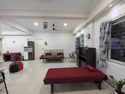 a living room with a couch and a table at Eva's Homestay at Cherai in North Paravur