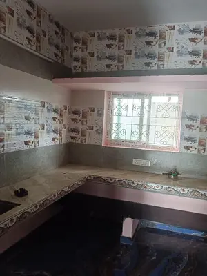 a room with a table and a window in it at Sona rooms in Coimbatore