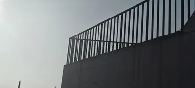a fence on the side of a building at Spirit of the Wild Mountain Retreat Attapadi in Attappādi