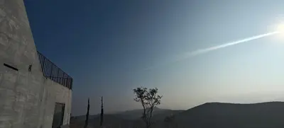 a view of the sky with a tree next to a building at Spirit of the Wild Mountain Retreat Attapadi in Attappādi