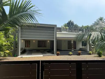 a house with a fence in front of it at Premium house near Cochin Airport for NRI families in Nedumbassery