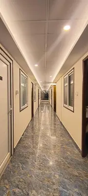 an empty hallway in an office building at Shri Bhagawathi Residency in Palani