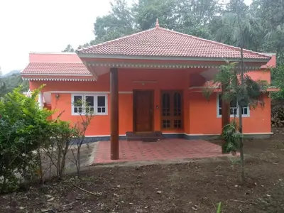 a small house with an orange at The Marayoor in Marayoor