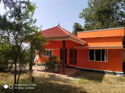 a small house with an orange at The Marayoor in Marayoor