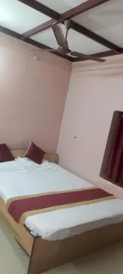 a bedroom with a bed in a room at Essaar Punnot Farmstay Resort in Kollengode