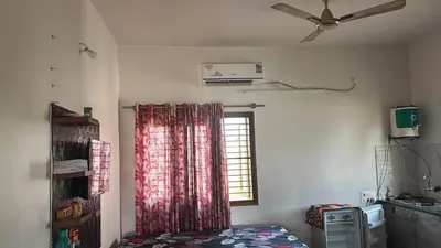 a room with a window with a red curtain at Free Private Room with Body Massage in Mysore