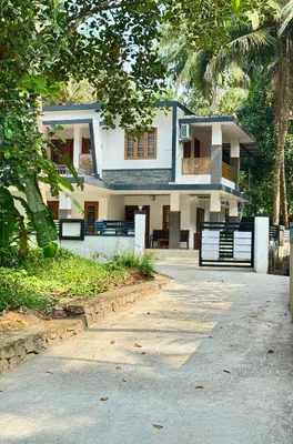 a house with a driveway in front of it at Sawan Homestay in Tāzhekkod