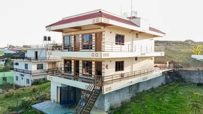 a house being constructed on top of a hill at Nature'call homestay in Ooty