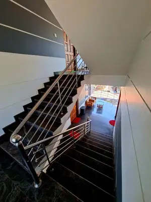an overhead view of a staircase in a building at Wayanad Pent House in Mananthavady